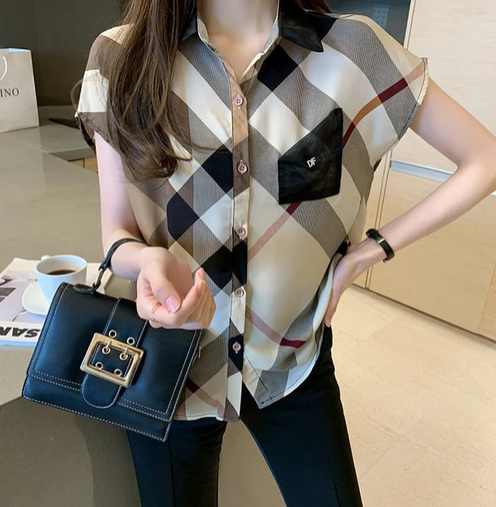 Short-sleeve checkered blouse with front pocket and button detail